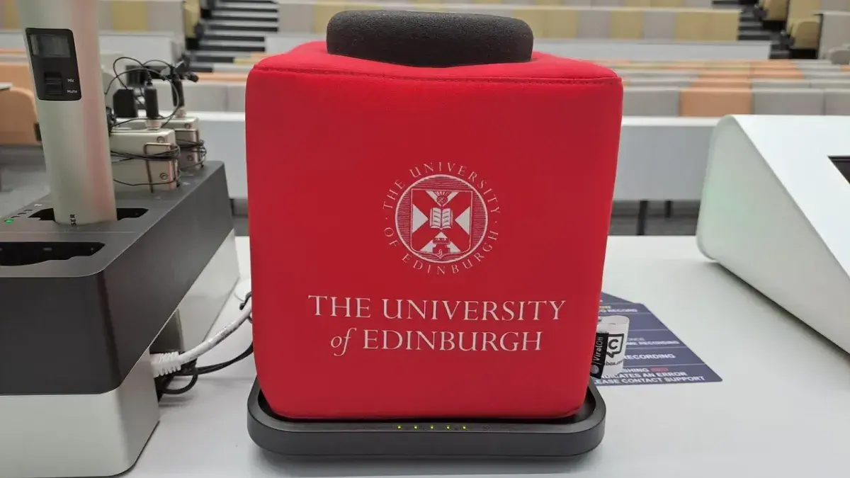 A photograph of a catch box microphone in a lecture room
