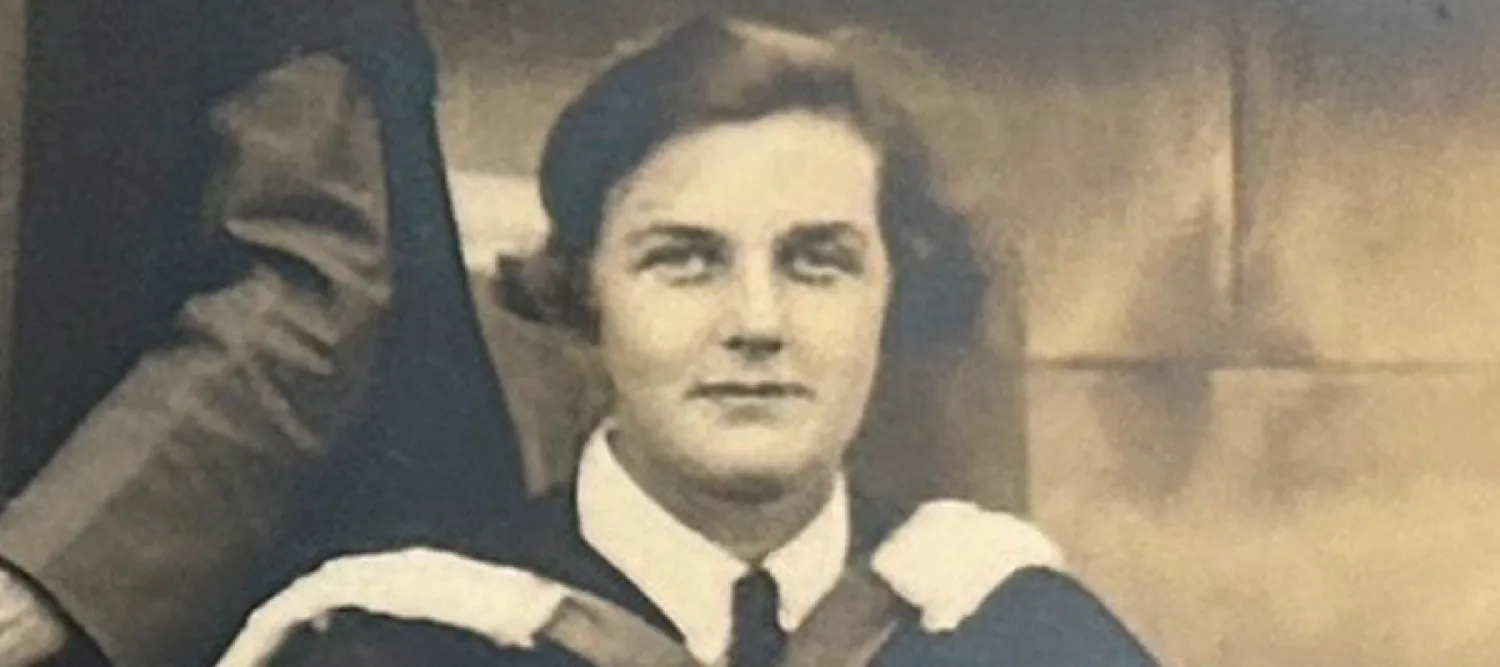 Black and white picture of Molly Fergusson during her University of Edinburgh graduation ceremony in 1936.