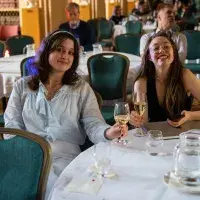 Two people smiling into the camera