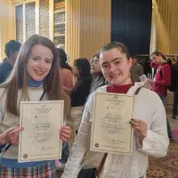 Edinburgh Award students in the Playfair Library, holding up their award certificates