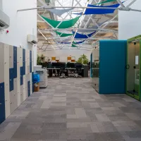 The entrance to the Forrest Hill Drill Hall, with lockers on the left and meeting pods on the right.