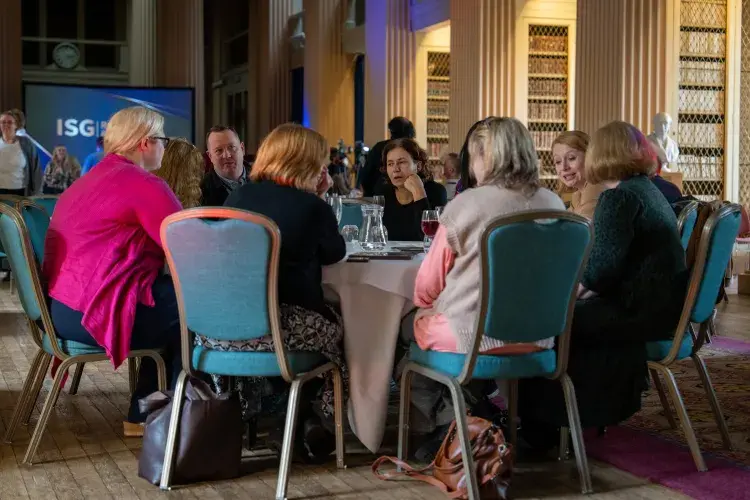 a group of people sitting at a table