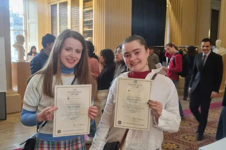 Edinburgh Award students in the Playfair Library, holding up their award certificates