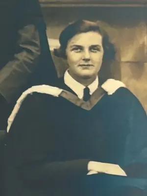 Black and white picture of Molly Fergusson during her University of Edinburgh graduation ceremony in 1936.