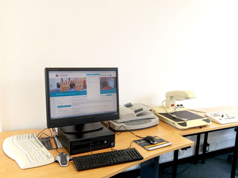 Accessible workstation, Law Library, with CCTV overhead magnifier, document feed scanner, ergonomic keyboard and Trackball mouse