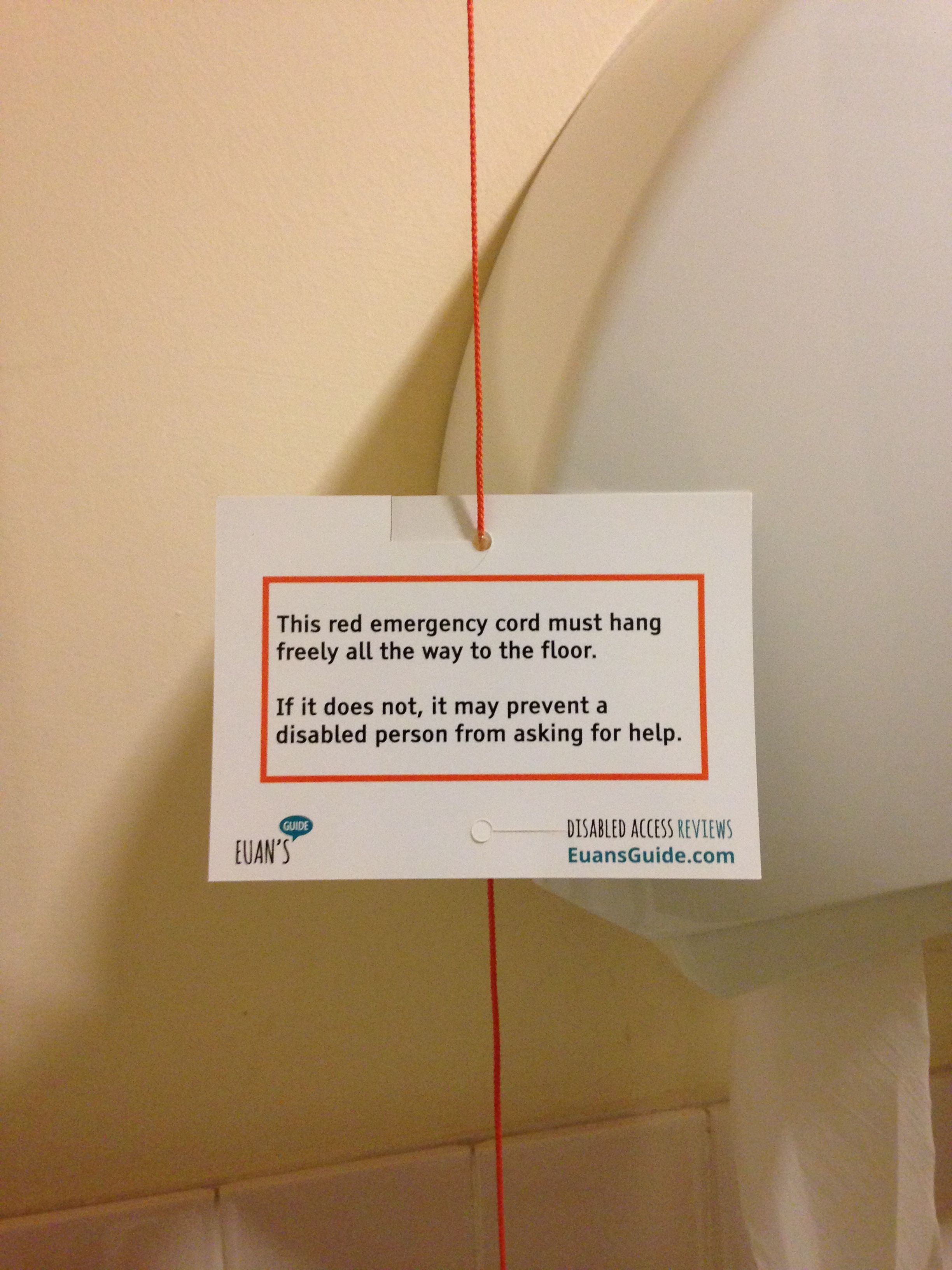 Toilet alarm cord notice alerting users not to tie the cord up