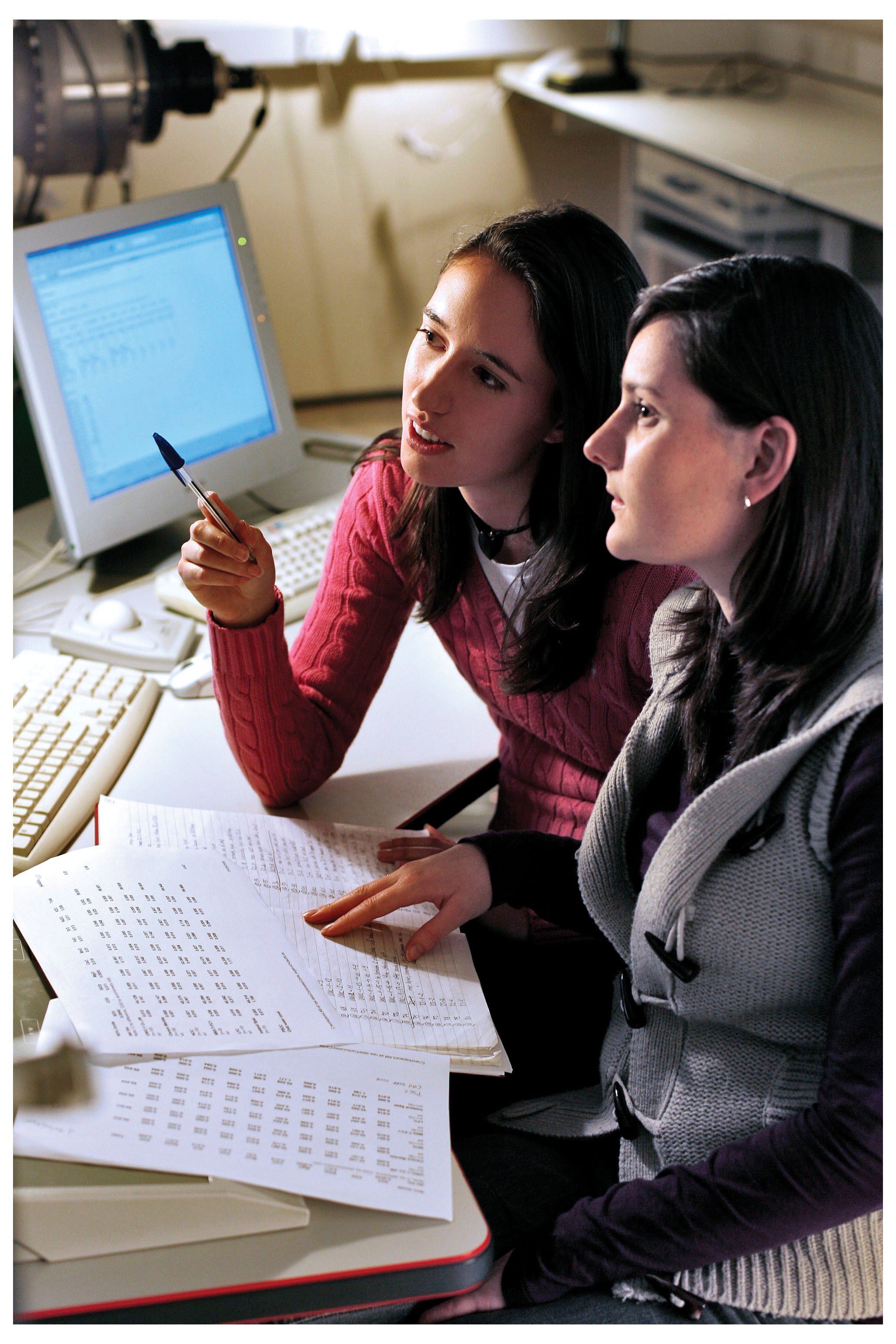 Two women at desktop computer