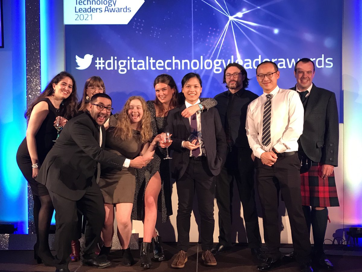 Members of the Learn Foundation Project Team, at the Digital Technology Leaders award ceremony, pose in front of a sign which reads \"'#digitaltechnologyleaderawards\"