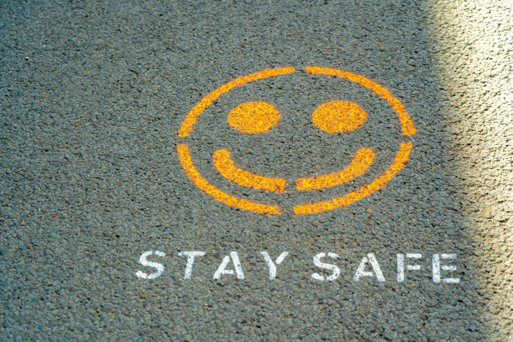 Smiley face above the words 'stay safe'