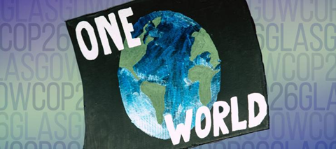 Banner for the UN Climate Change Conference (COP26). A black flag with an image of earth with the text \"One\" above the image of the earth and \"World\" below it. The background is different shades of blue and green with the text \"GlasgowCOP26\" repeated.