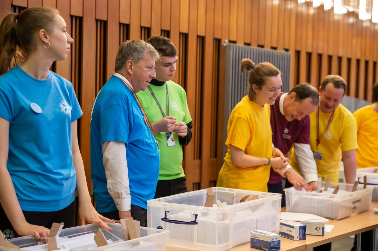 Peter Mathieson, Gavin MacLachlan and Andrew Wilson helping out at Wecome Week 2019 at the Main Lib